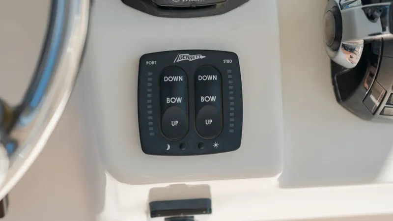 Slide: The Image of Trim tab control on Grady-White Canyon 306 boat, year 2019. - 30