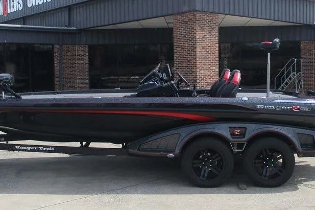 The Image of 2025 Ranger Z520R boat with sleek black and red design, parked on a trailer. - 0