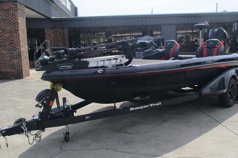 Slide: The Image of 2025 Ranger Z520R bass boat on trailer, parked outside a building. - 3