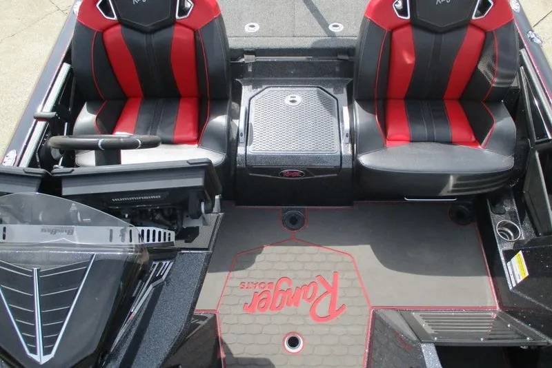 Slide: The Image of 2025 Ranger Z520R boat interior with red and black seats, steering console, and branded flooring. - 5