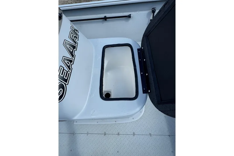 Slide: The Image of SeaArk Shadow 18T 2025 boat interior with open storage compartment. - 15