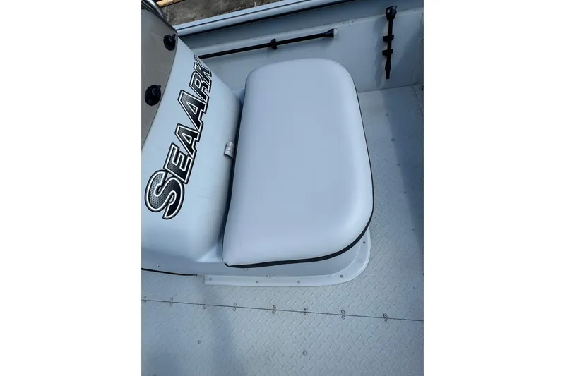 Slide: The Image of 2025 SeaArk Shadow 18T boat interior with cushioned seat and SeaArk branding. - 16