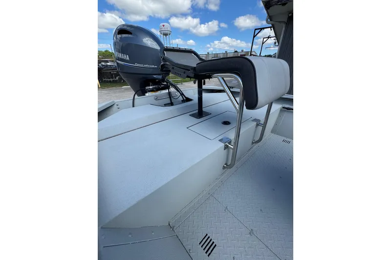 Slide: The Image of 2025 SeaArk Shadow 18T boat with Yamaha engine, featuring a sleek design and comfortable seating. - 18