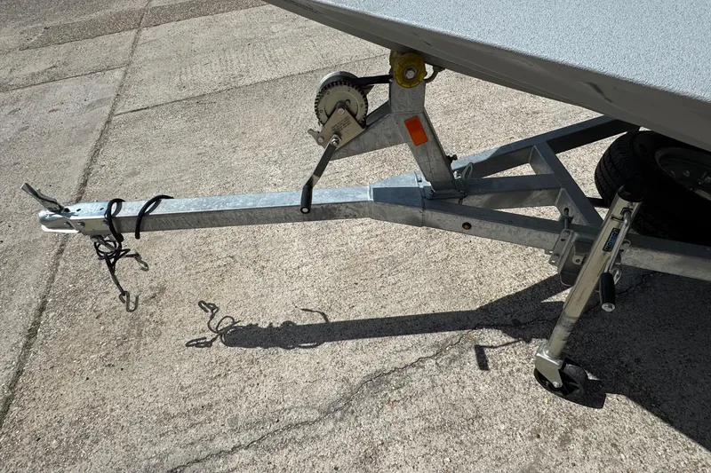 Slide: The Image of Trailer hitch of 2025 SeaArk Shadow 18T boat on concrete surface. - 5