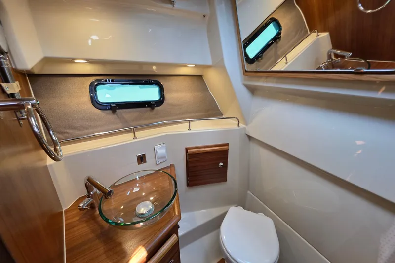 Slide: The Image of Luxurious 2026 Ranger Tugs R-27 boat bathroom with modern fixtures and elegant design. - 20