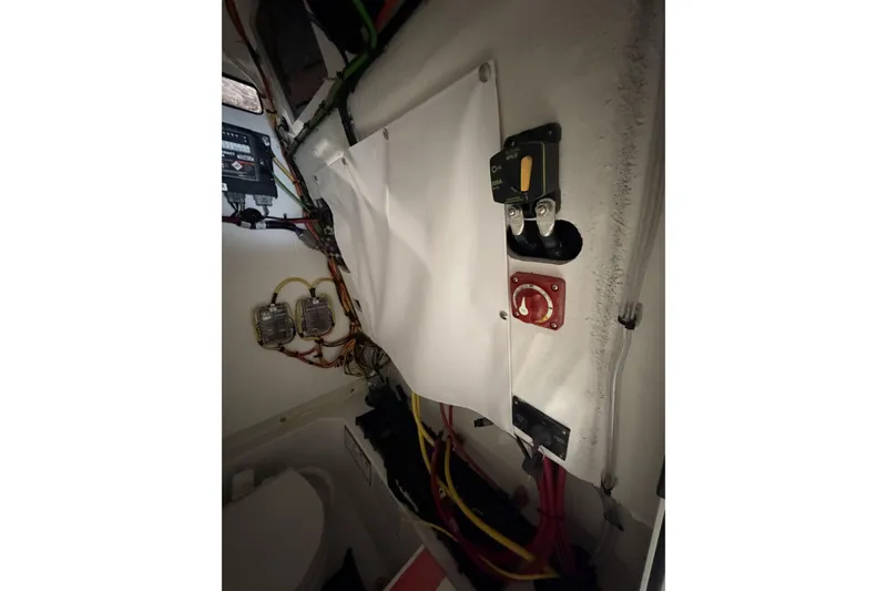 Slide: The Image of Interior wiring and controls of a 2026 Sportsman Open 232 Center Console boat. - 12