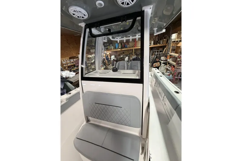 Slide: The Image of 2026 Sportsman Open 232 Center Console interior with seating and storage features. - 16