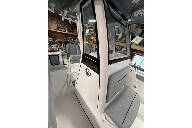 Slide: The Image of 2026 Sportsman Open 232 Center Console boat interior with seating and console details. - 18
