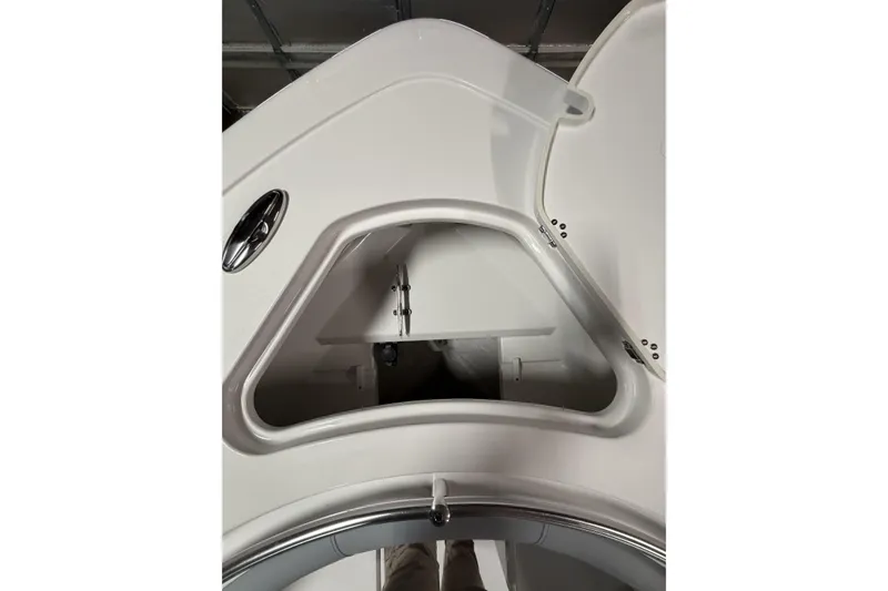 Slide: The Image of 2026 Sportsman Open 232 Center Console boat storage compartment detail. - 20