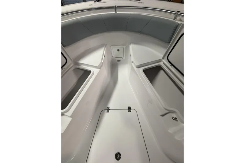 Slide: The Image of 2026 Sportsman Open 232 Center Console boat interior with storage compartments. - 21