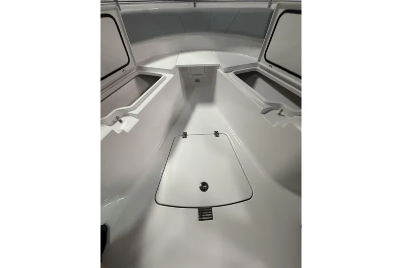 Slide: The Image of 2026 Sportsman Open 232 Center Console boat interior with storage compartments. - 23