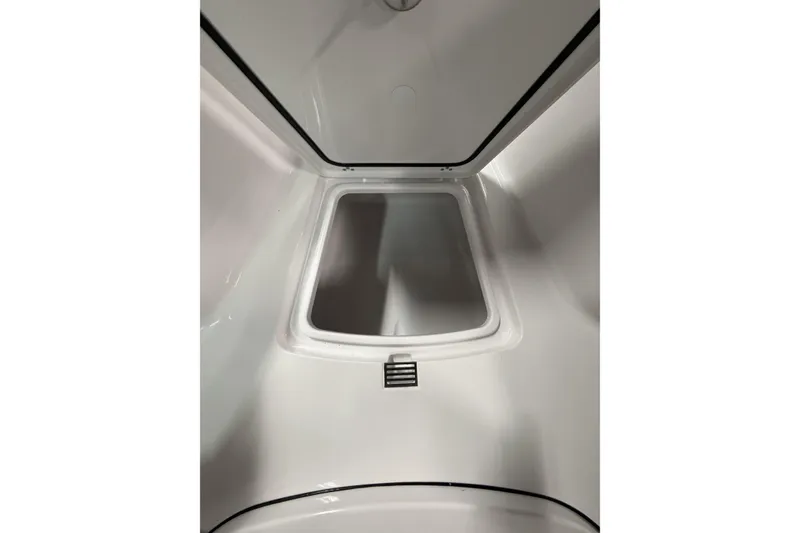 Slide: The Image of Interior view of 2026 Sportsman Open 232 Center Console boat compartment. - 24