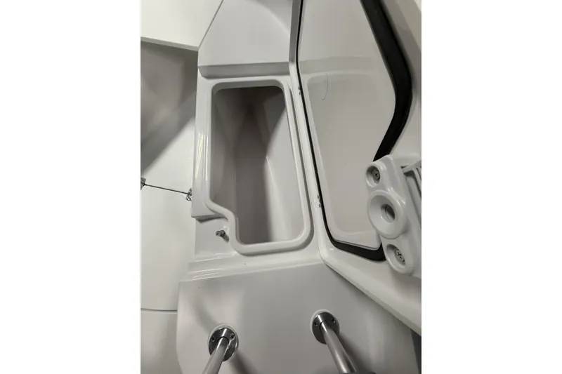 Slide: The Image of 2026 Sportsman Open 232 Center Console storage compartment detail. - 25
