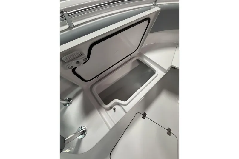Slide: The Image of 2026 Sportsman Open 232 Center Console storage compartment, showcasing sleek design and functionality. - 26