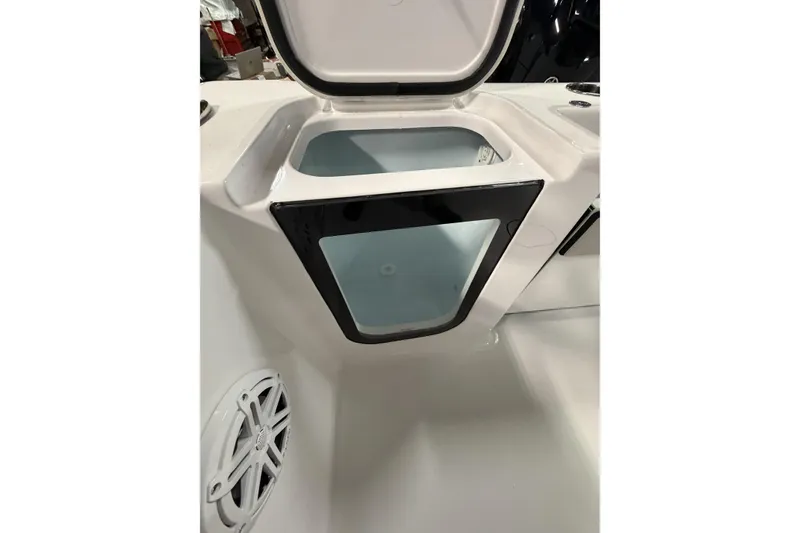 Slide: The Image of Open storage compartment on 2026 Sportsman Open 232 Center Console boat. - 31