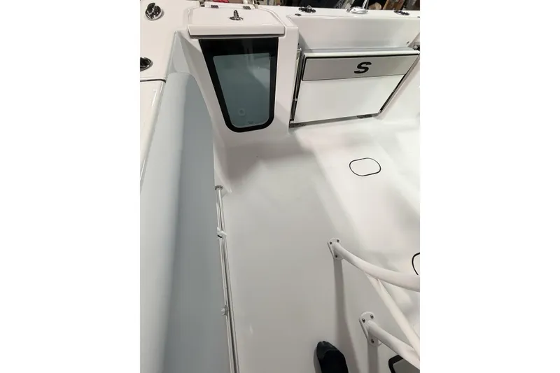 Slide: The Image of 2026 Sportsman Open 232 Center Console interior with storage compartment and sleek design. - 33