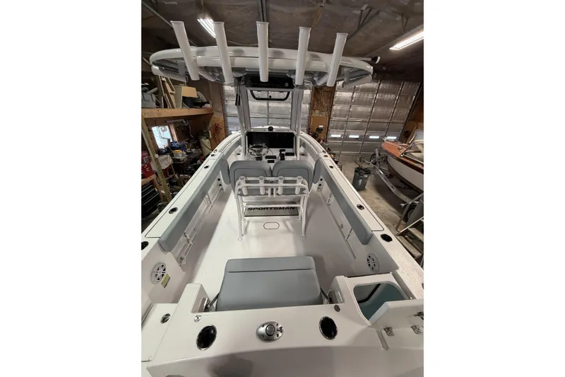 Slide: The Image of 2026 Sportsman Open 232 Center Console boat interior in a garage setting. - 36