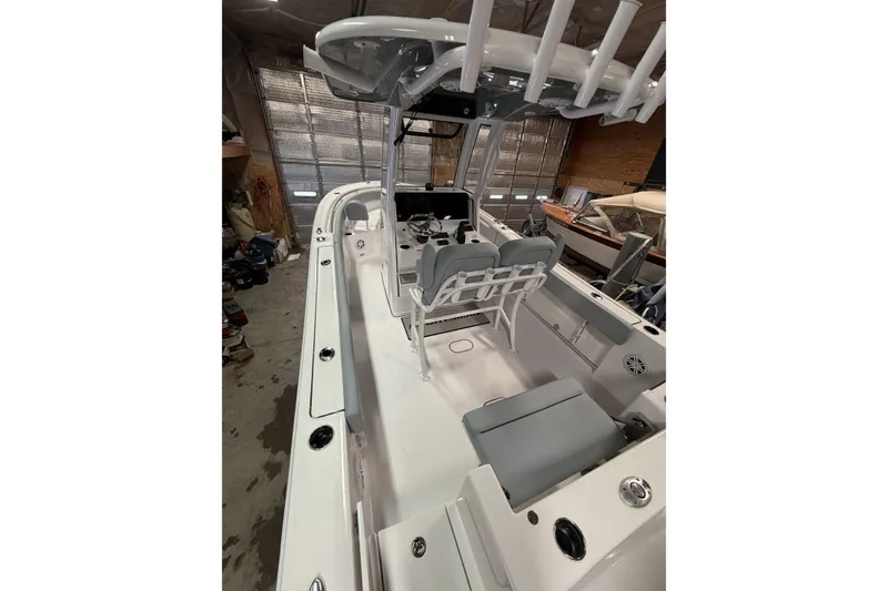 Slide: The Image of 2026 Sportsman Open 232 Center Console boat interior with seating and helm station. - 37