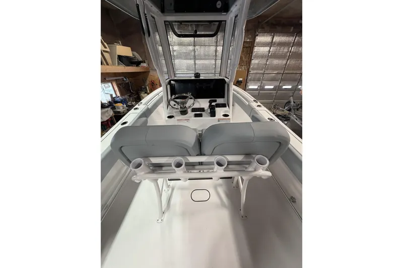 Slide: The Image of 2026 Sportsman Open 232 Center Console boat interior with helm and seating. - 4