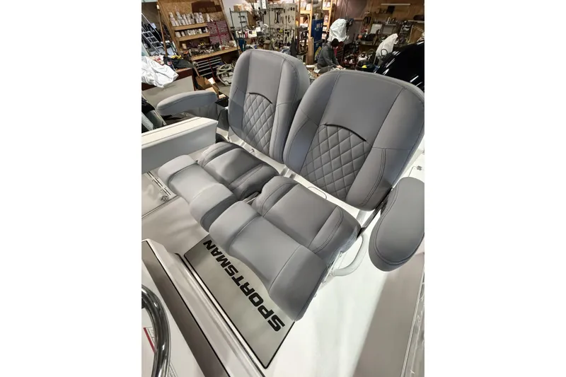 Slide: The Image of 2026 Sportsman Open 232 Center Console boat seats in a workshop setting. - 5