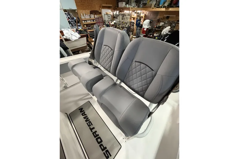 Slide: The Image of 2026 Sportsman Open 232 Center Console boat seats in a workshop setting. - 6