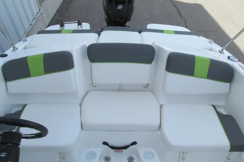 Slide: The Image of 2022 Tahoe T16 boat interior with white and green cushioned seating. - 12