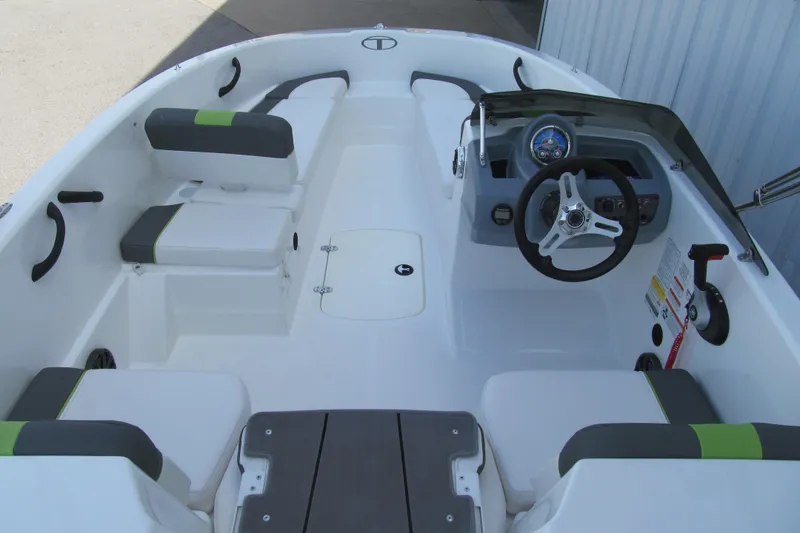Slide: The Image of 2022 Tahoe T16 boat interior with steering wheel and seating arrangement. - 4