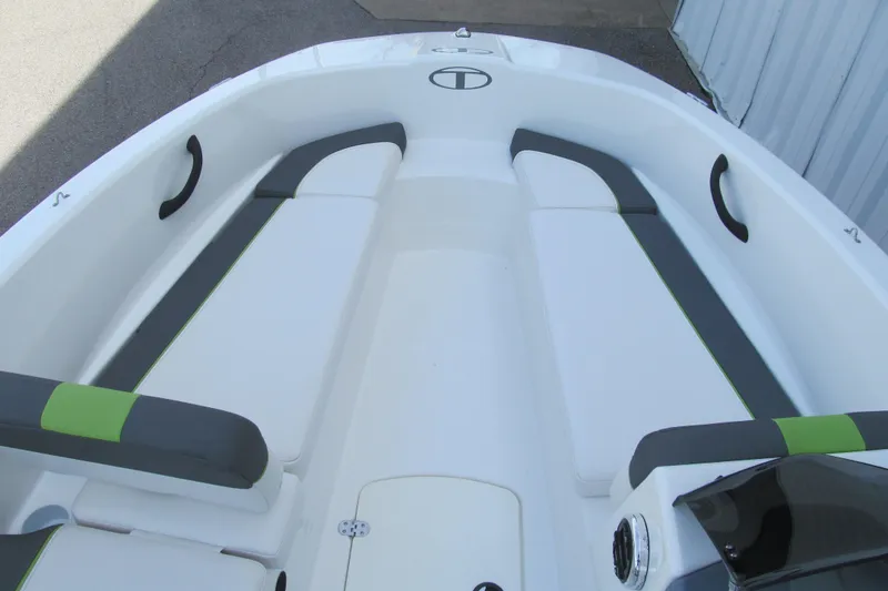 Slide: The Image of 2022 Tahoe T16 boat interior with white and gray seating, green accents. - 7