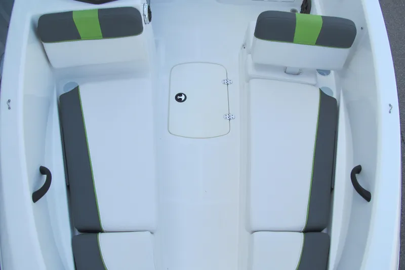 Slide: The Image of 2022 Tahoe T16 boat interior with gray and green cushioned seating. - 8