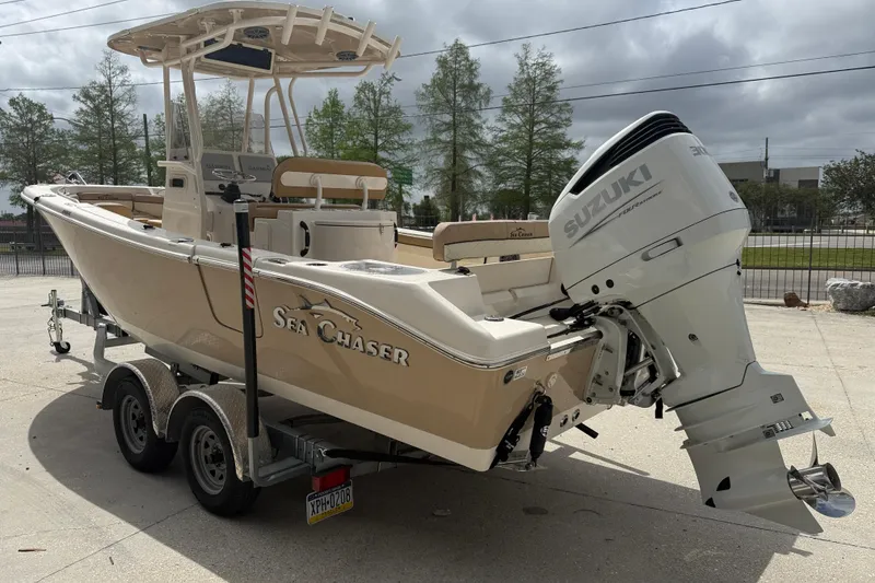Slide: The Image of 2023 SeaChaser 24 HFC boat with Suzuki outboard motor on a trailer. - 4