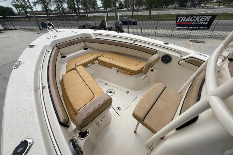 Slide: The Image of 2023 SeaChaser 24 HFC boat interior with tan seating and spacious layout. - 9