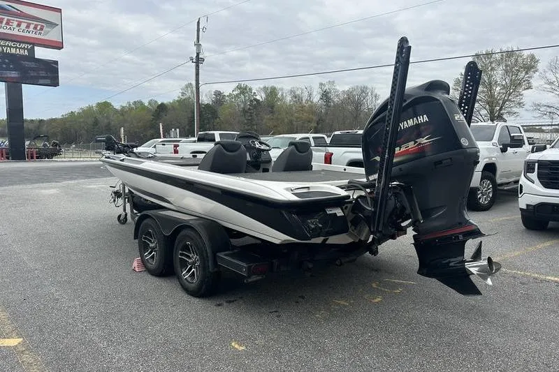 Slide: The Image of 2021 Caymas CX 19 boat with Yamaha engine on trailer in parking lot. - 4