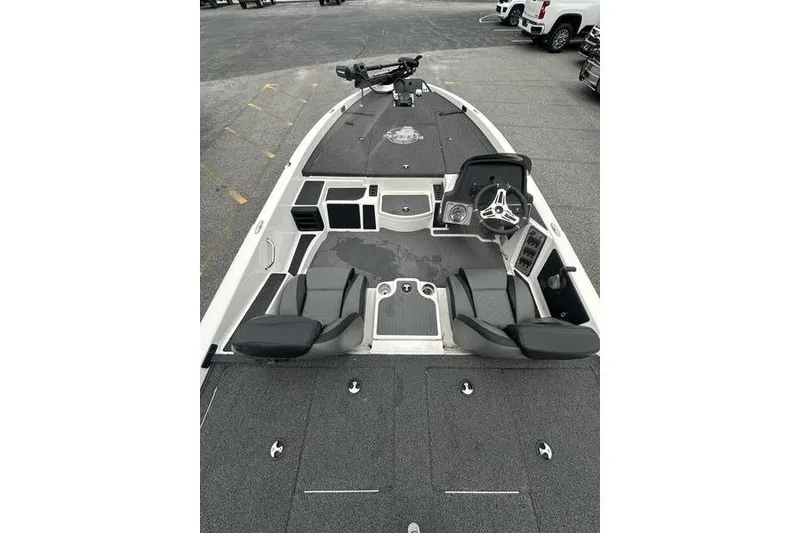 Slide: The Image of 2021 Caymas CX 19 boat interior with steering wheel and seating. - 6