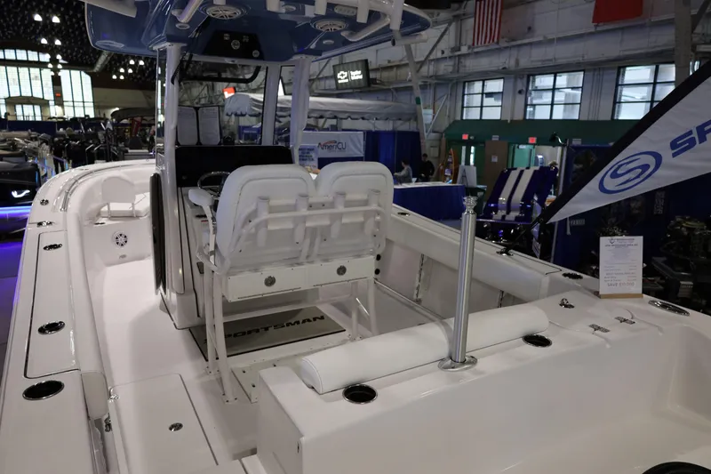 Slide: The Image of 2026 Sportsman Open 252 Center Console boat displayed at an indoor exhibition. - 10