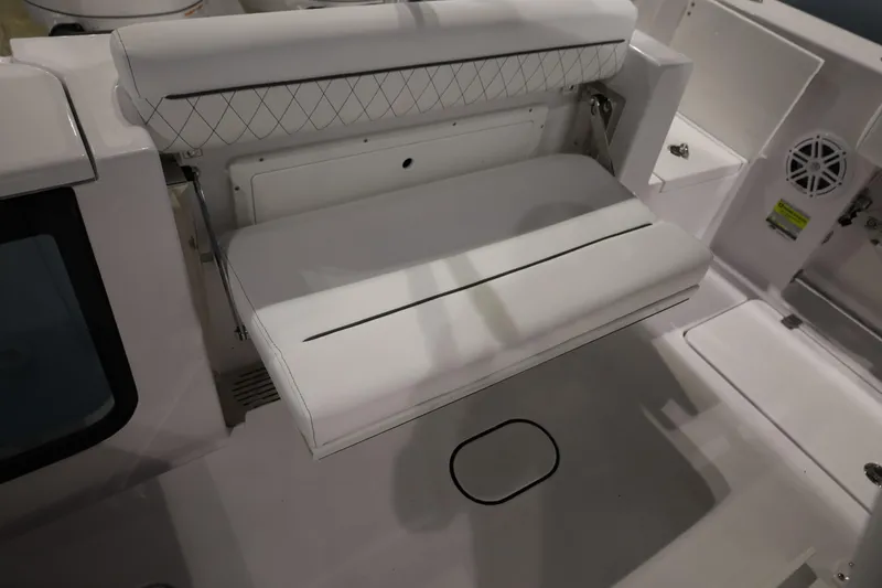 Slide: The Image of 2026 Sportsman Open 252 Center Console boat seat with white cushioned design. - 13