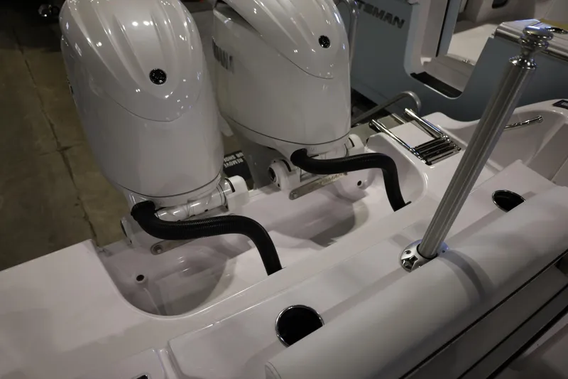 Slide: The Image of 2026 Sportsman Open 252 Center Console with dual outboard engines. - 14