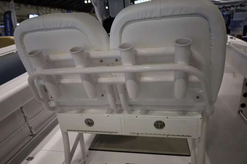 Slide: The Image of 2026 Sportsman Open 252 Center Console boat seating with rod holders and storage. - 15