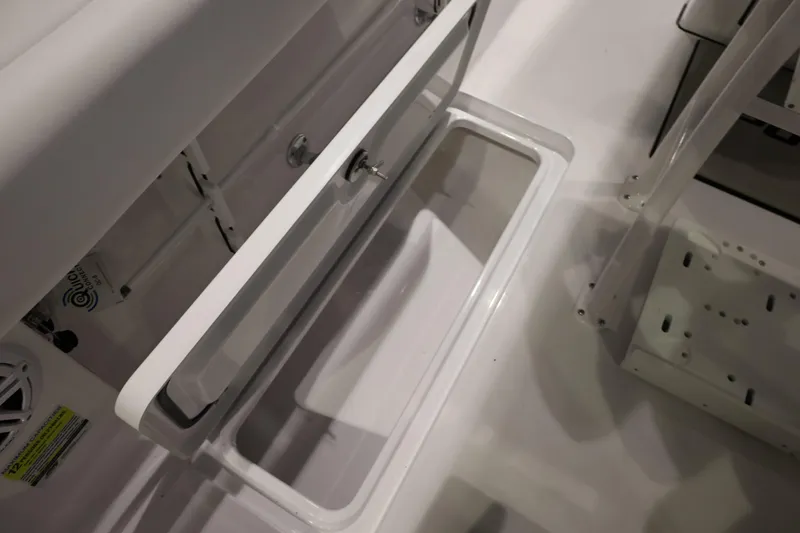 Slide: The Image of Open storage compartment on 2026 Sportsman Open 252 Center Console boat. - 18
