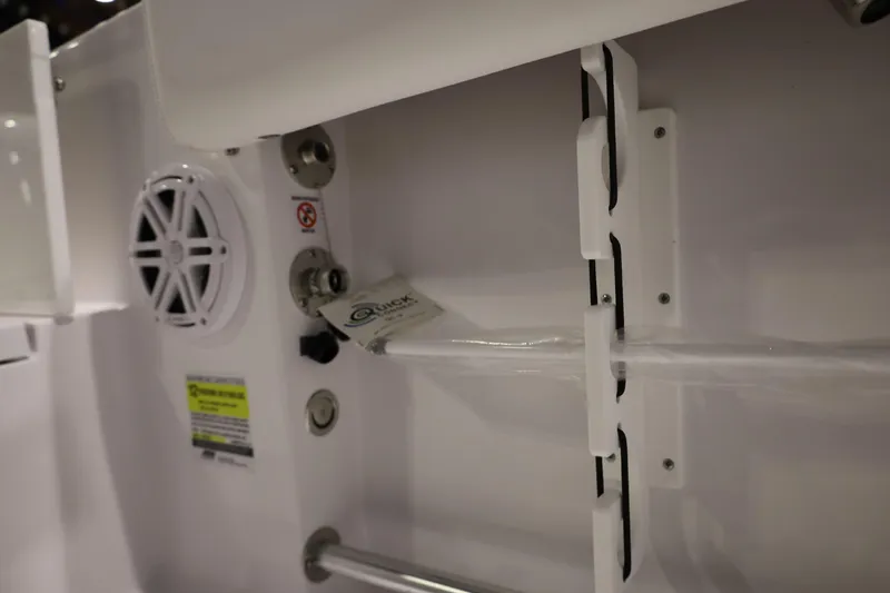 Slide: The Image of Interior view of 2026 Sportsman Open 252 Center Console boat, featuring speaker and controls. - 20