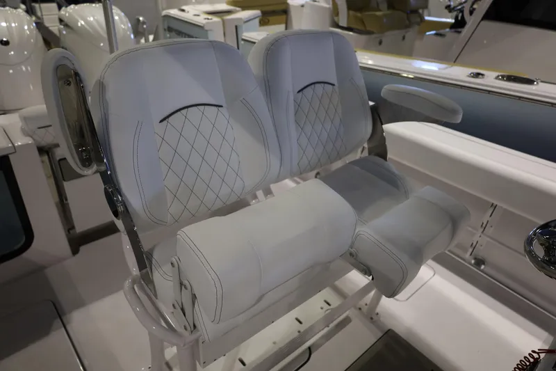 Slide: The Image of 2026 Sportsman Open 252 Center Console boat with luxurious white seating. - 24