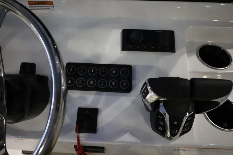 Slide: The Image of 2026 Sportsman Open 252 Center Console dashboard with steering wheel and controls. - 26