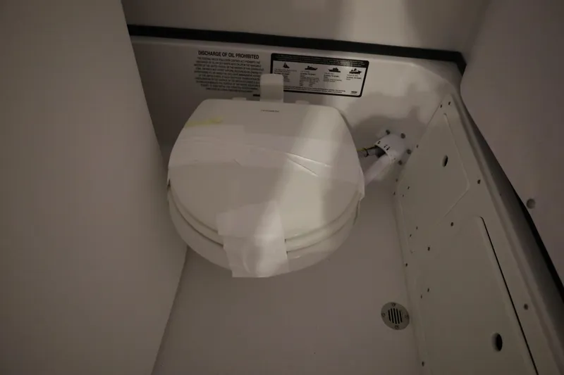 Slide: The Image of Boat toilet in 2026 Sportsman Open 252 Center Console cabin. - 29