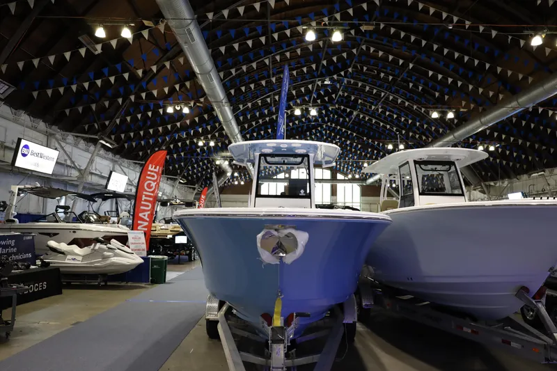 Slide: The Image of 2026 Sportsman Open 252 Center Console boat displayed at indoor exhibition. - 3