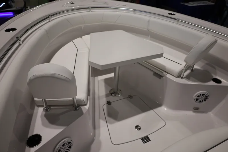 Slide: The Image of 2026 Sportsman Open 252 Center Console boat interior with seating and table. - 31