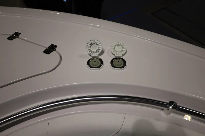 Slide: The Image of 2026 Sportsman Open 252 Center Console boat deck with open hatches and rail. - 35