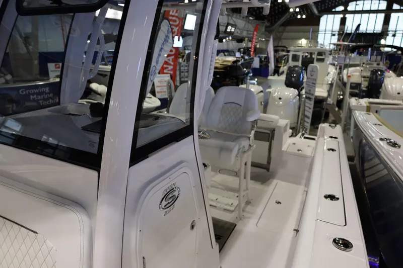 Slide: The Image of 2026 Sportsman Open 252 Center Console boat displayed at a marine exhibition. - 39