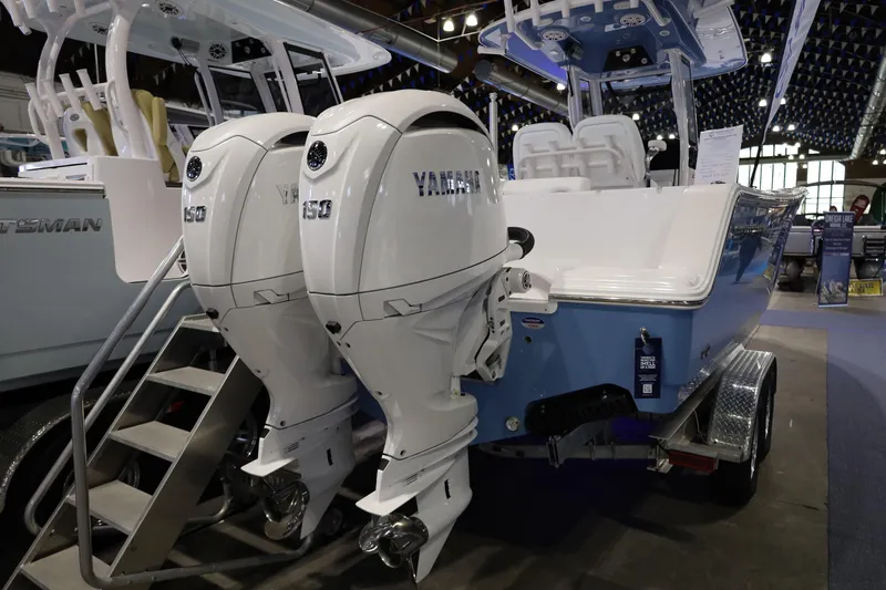 Slide: The Image of 2026 Sportsman Open 252 Center Console boat with dual Yamaha engines displayed indoors. - 4