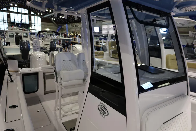Slide: The Image of 2026 Sportsman Open 252 Center Console boat interior at a boat show. - 40