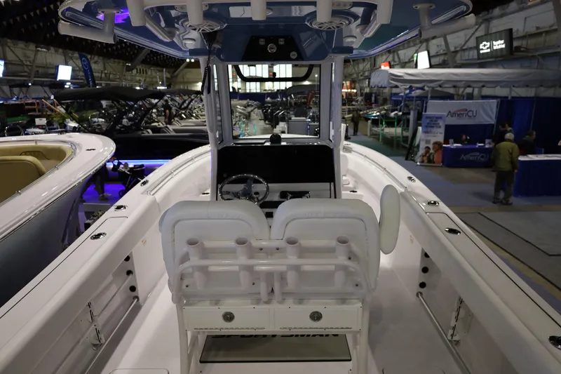 Slide: The Image of 2026 Sportsman Open 252 Center Console boat displayed at an indoor exhibition. - 41
