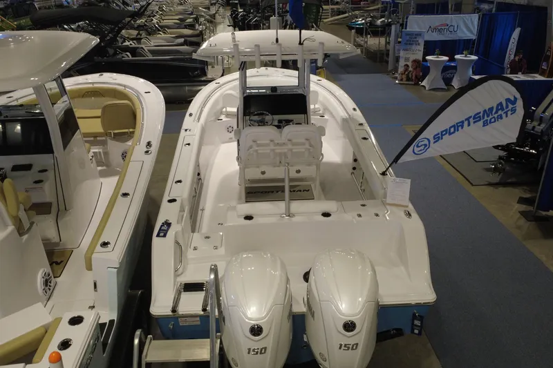 Slide: The Image of 2026 Sportsman Open 252 Center Console boat displayed at an indoor exhibition. - 6